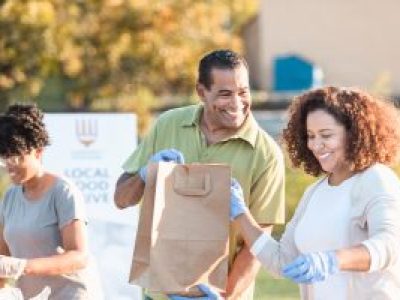 Volunteers carrying bags