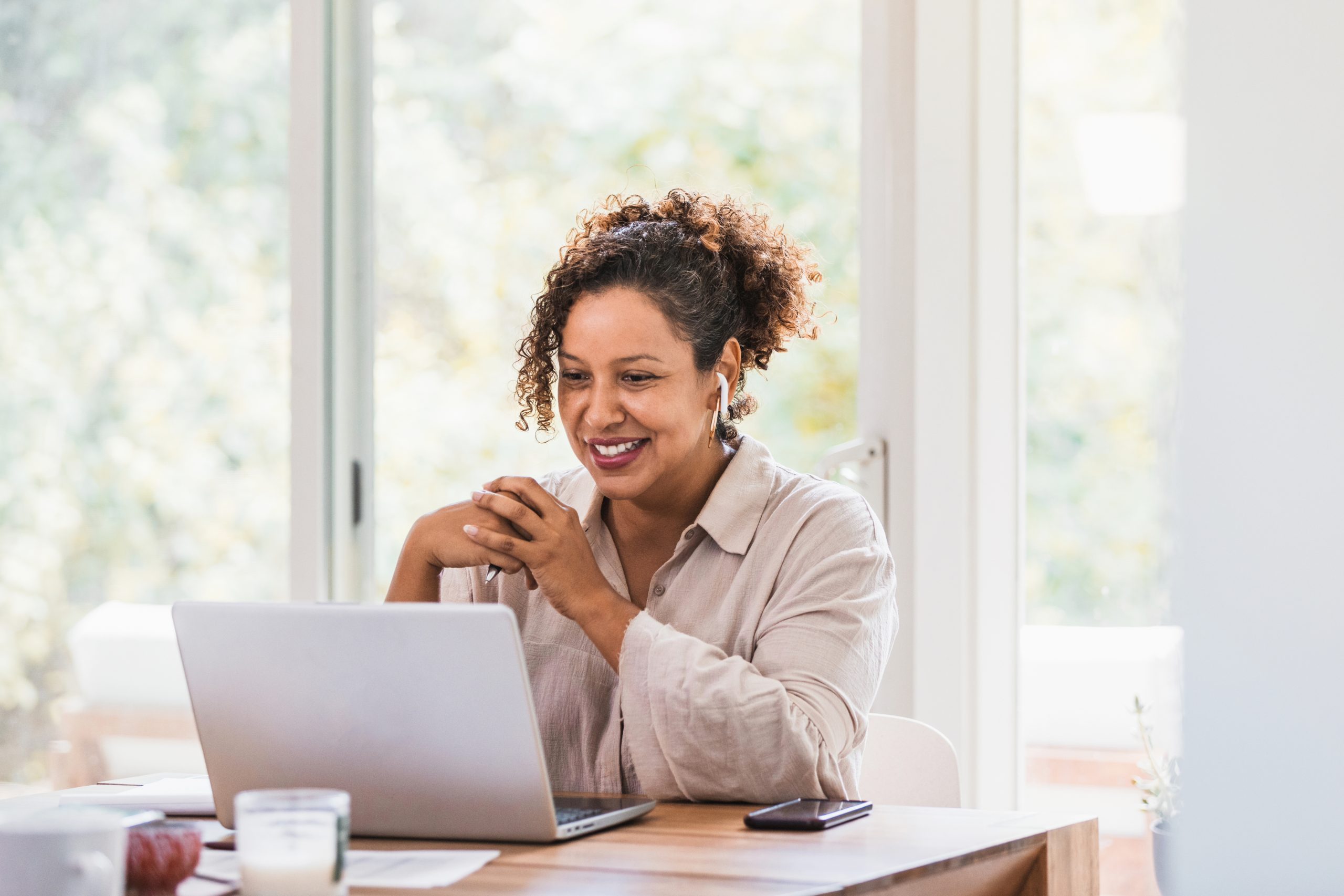 Woman attending virtual meeting